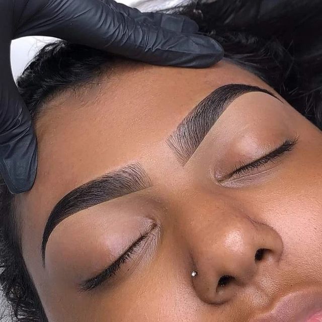 Close-up of microshaded brows on a client resting in the treatment chair