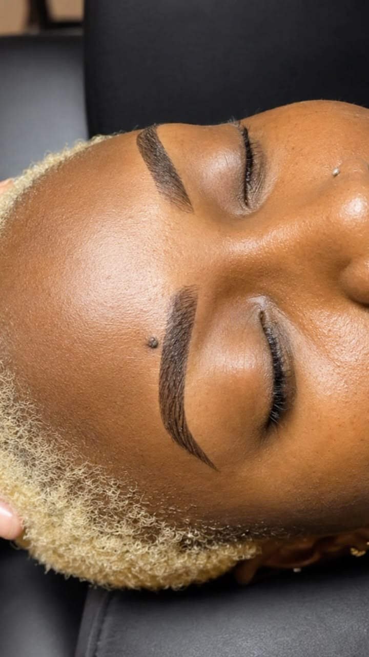 A client after her brow lamination and tint, inside the studio