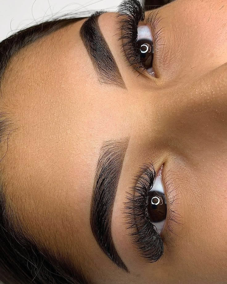 A client with finished microshaded brows in the Ellimak treatment chair
